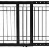 Black adjustable wooden pet gate with vertical bars for indoor use