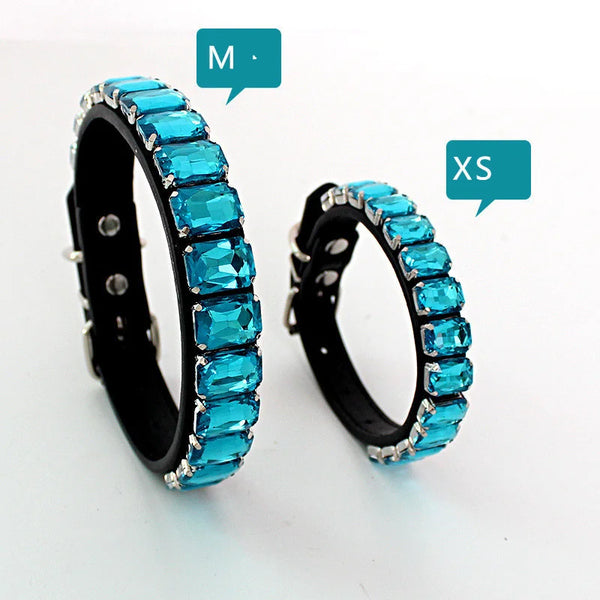 A pair of sparkling blue crystal rhinestone dog collars, one medium and one extra-small size.