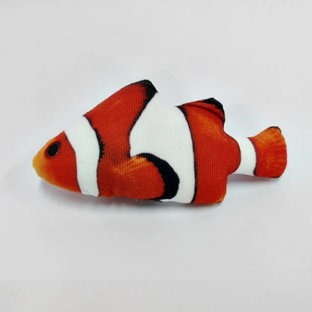 An orange and white fish-shaped plush toy with black markings.
