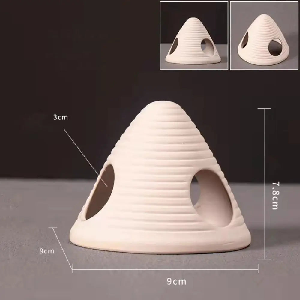 A beige ceramic aquarium shrimp hideaway cave with ribbed texture shown from the top and side.