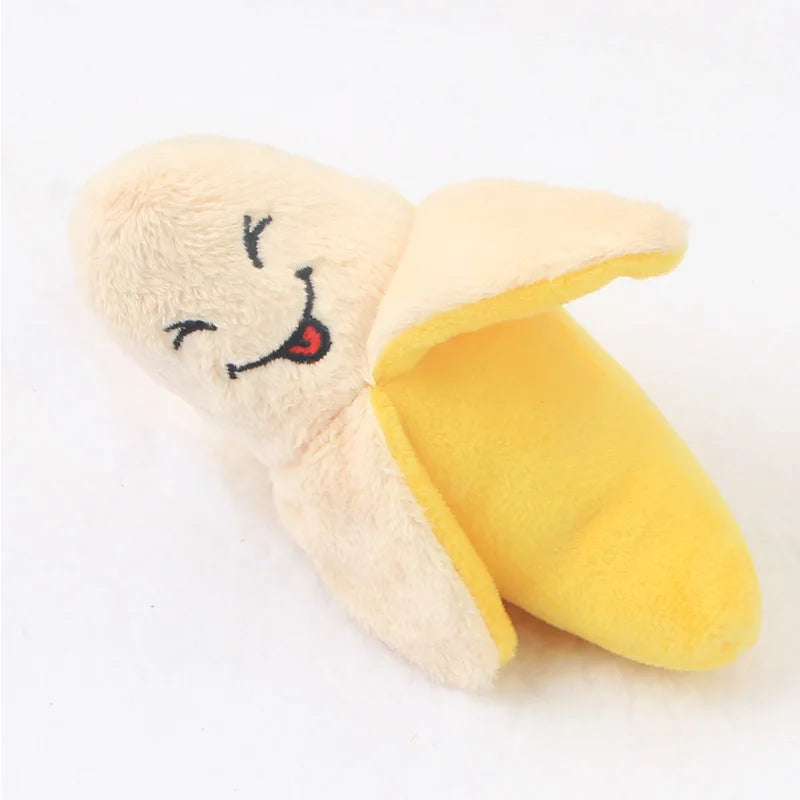 A soft, bone-shaped squeaky plush dog toy in pale yellow and cream colors.