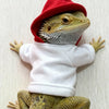 A bearded dragon costume featuring a lizard head and body wearing a red hat and a white shirt.