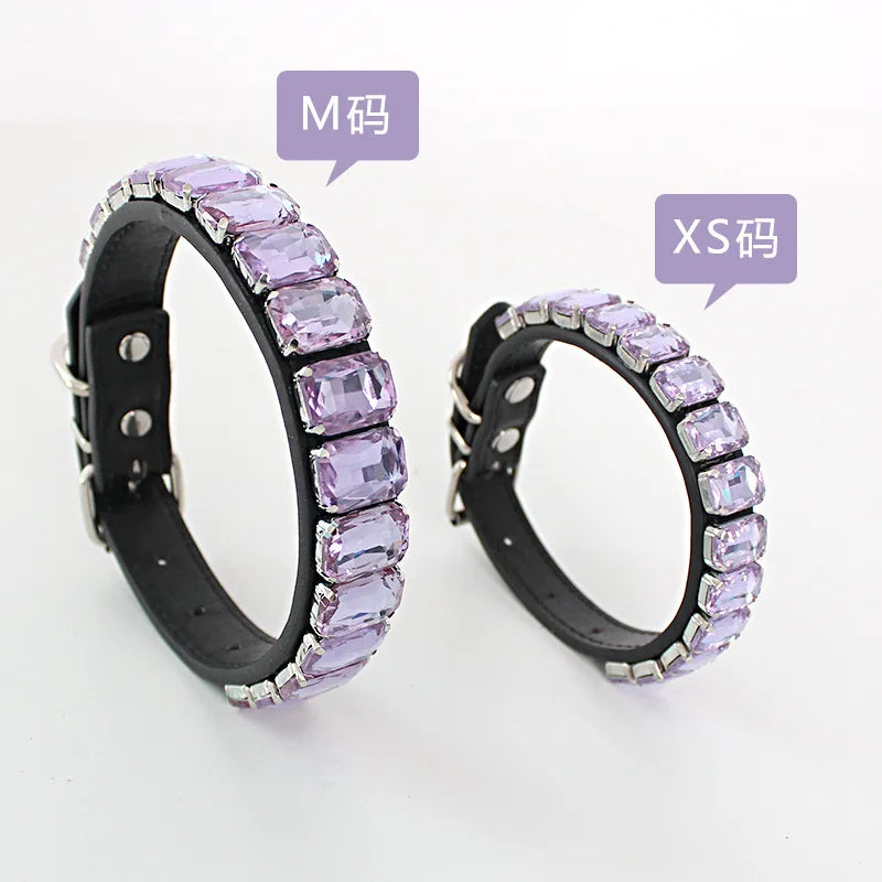 Two silver-toned dog collars featuring rows of purple and clear crystal rhinestones.