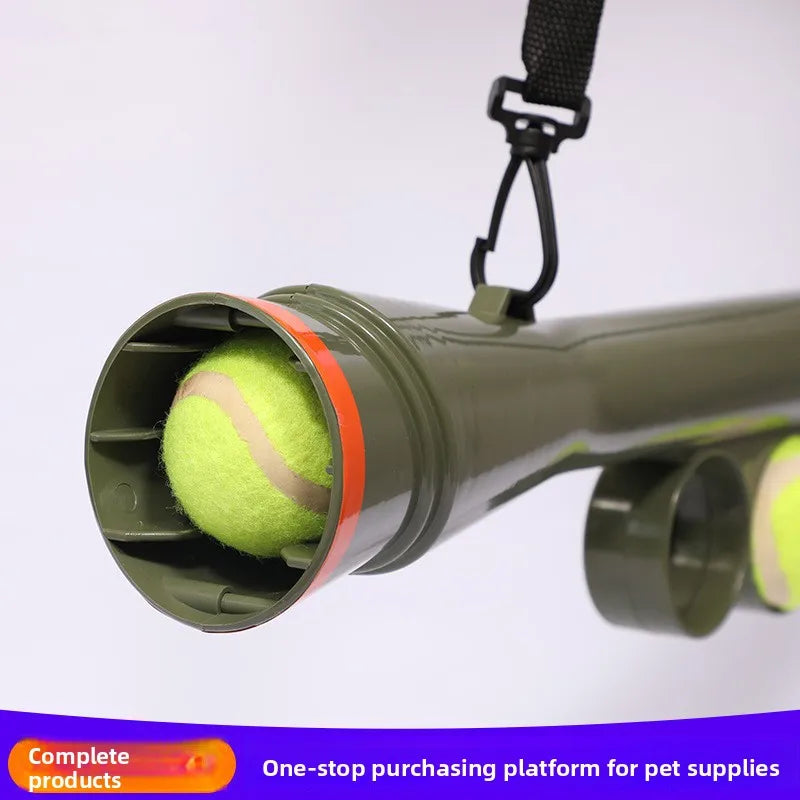 A green interactive pet ball launcher with a ball attached, shown against a white background.