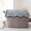 Tente removable grise pour chiens et chats avec une couverture douce grise sur un tapis blanc.