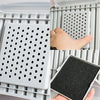 A close-up view of activated carbon litter box filter pads with perforated surfaces being placed into a plastic tray.