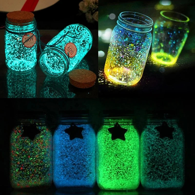 Various jars filled with glow-in-the-dark decorative pebbles showing vibrant green and blue light.