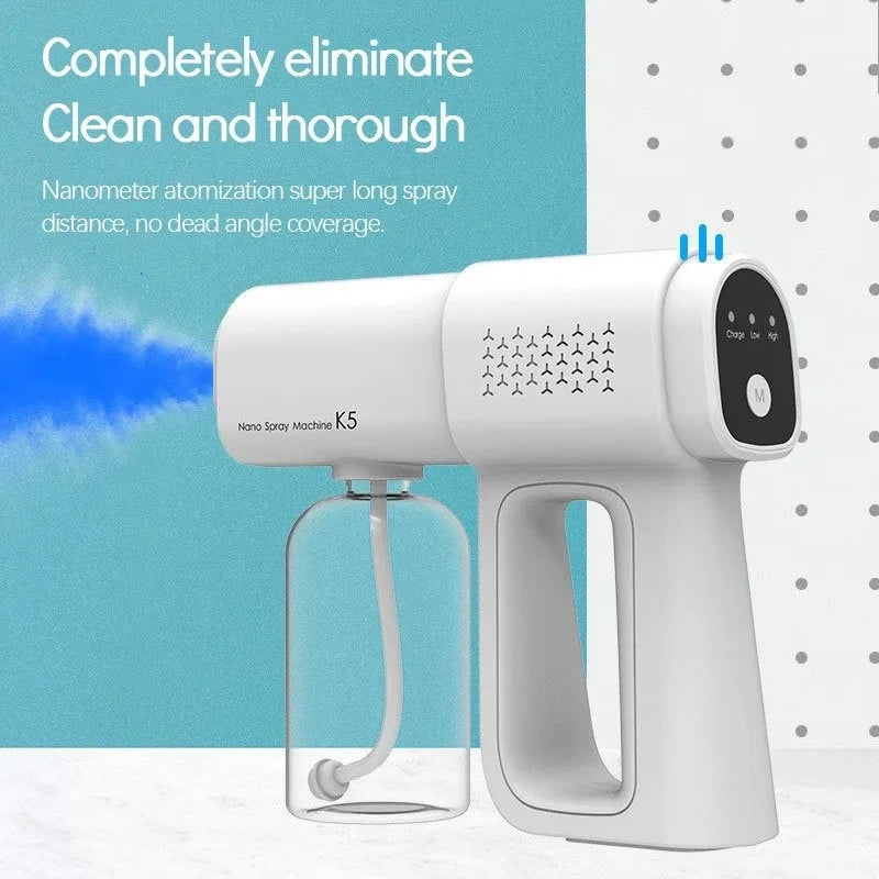 A white portable nano spray machine with a clear bottle is shown against a light blue background.