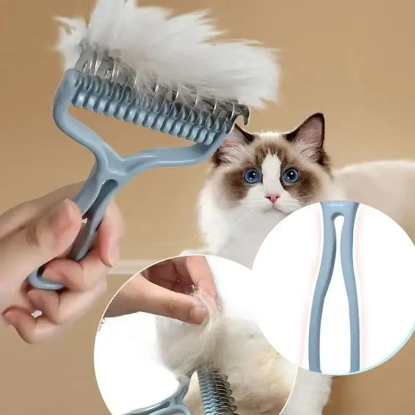 A hand holds a light blue pet hair removal comb being used on a cat's fur.