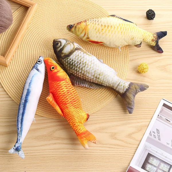 A collection of plush cat teasing toys shaped like various fish, including a gold-colored fish and an orange fish.