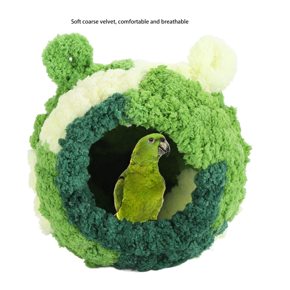 A green velvet bird nest bed with a circular entrance, surrounded by soft green and white fluffy material.