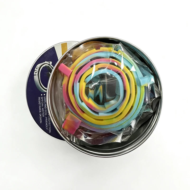 A tin of colorful calming pheromone collars for cats and dogs, showing various shades of pink, yellow, blue, and green.