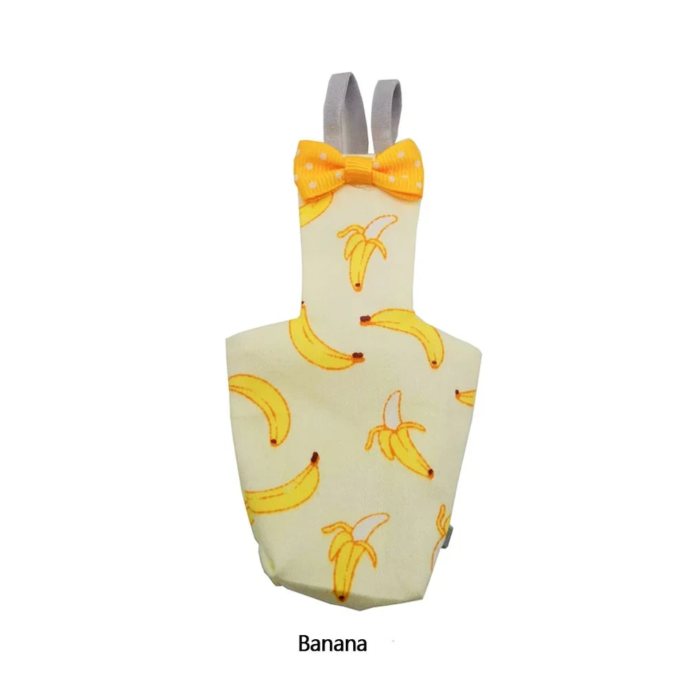 A yellow diaper flight suit decorated with banana patterns and a yellow floral bow tie.