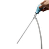 A hand is holding a silver aquarium siphon pump with a blue handle, angled for water transfer.