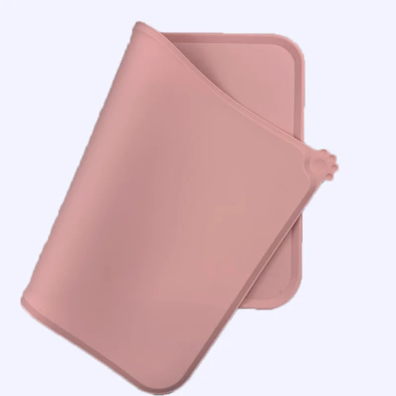 A pink waterproof silicone pet feeding mat shown from a top-down angle.