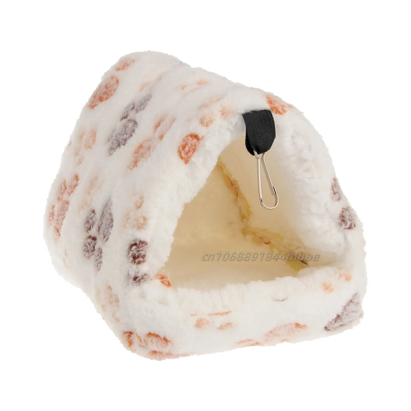 A white and orange patterned fleece pet nest bed with a black loop for hanging.