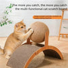 A small orange cat is climbing and playing on a wooden scratching board made of sisal rope.
