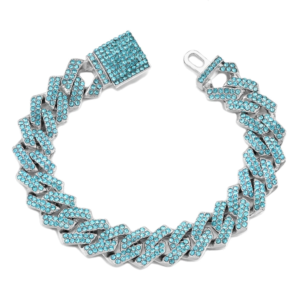 Silver iced-out Cuban link bracelet featuring blue rhinestones and a square clasp.