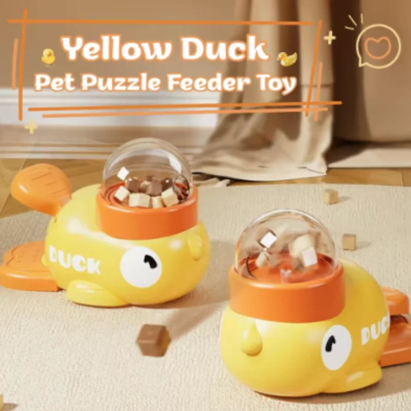 Two yellow duck pet puzzle feeder toys are shown on a light surface.