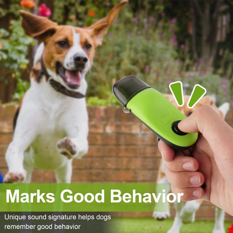 A dog is looking at a green training clicker device being held by a hand, with text indicating it marks good behavior.