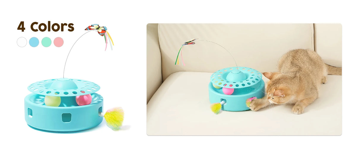 A blue interactive cat toy with a fluttering butterfly and feather is shown next to a tabby cat on a white sofa.