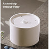 A white ceramic automatic pet water fountain with water flowing and a 1000ml capacity marker.