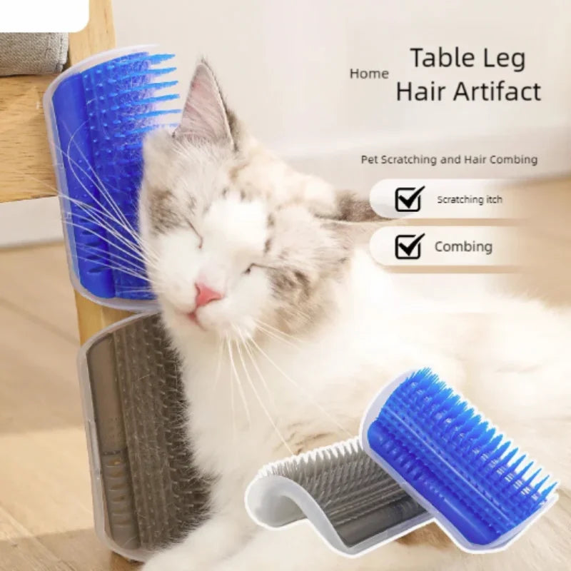 A fluffy gray and white cat is using a blue silicone brush for grooming on a wooden surface.