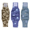 Three reusable dog belly bands in brown, purple, and gray fabric with paw print designs.
