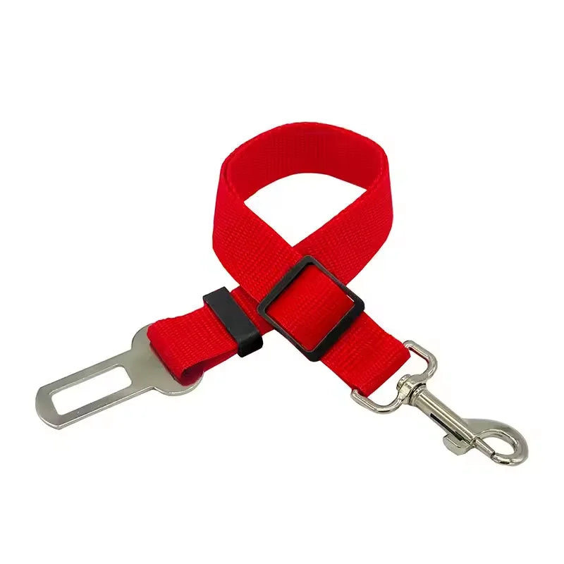Red adjustable pet car safety harness with a seat belt clip and metal hook.