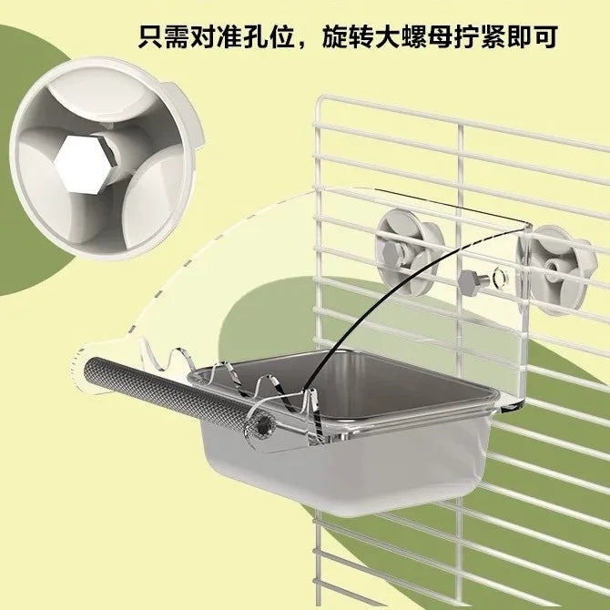 A stainless steel pet feeding bowl is shown being fed by a rotating mechanism inside a wire cage.