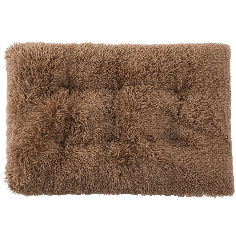 A rectangular brown plush pet bed mat with a non-slip texture.