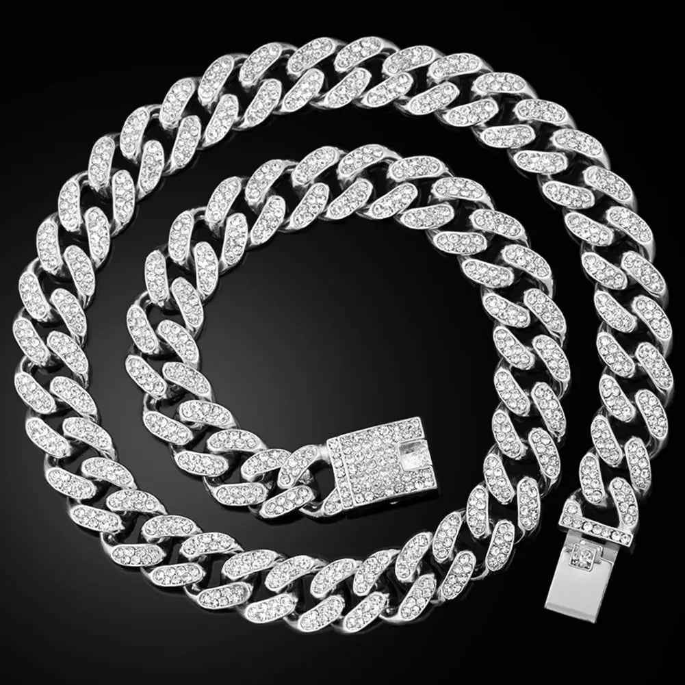 A set of dainty diamond Cuban link necklaces displayed against a black background.