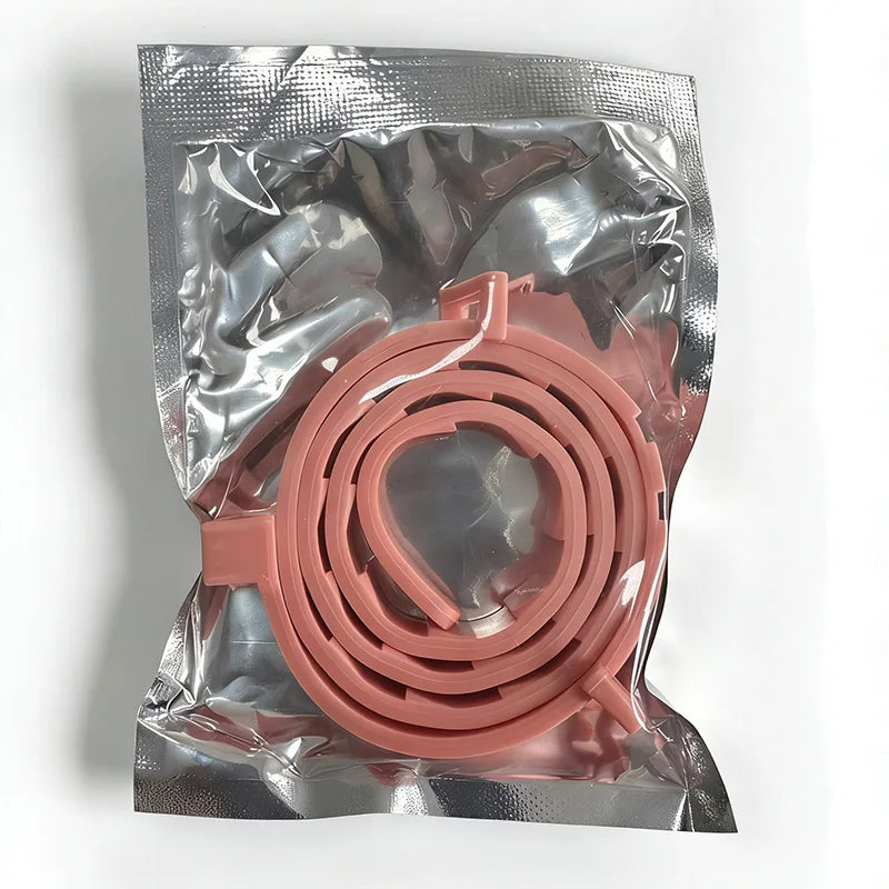 A clear plastic bag contains a pink adjustable silicone pet collar for small dogs and cats.