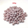 A pile of 200g pink quartz bio filter balls for aquariums