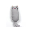 A gray plush cat toy shaped like a face with orange ears and a pink nose.