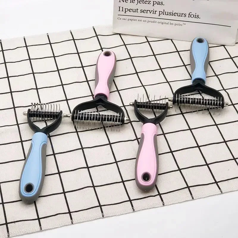 A set of pink and blue stainless steel pet hair removal comb brushes for dogs and cats displayed on a grid.