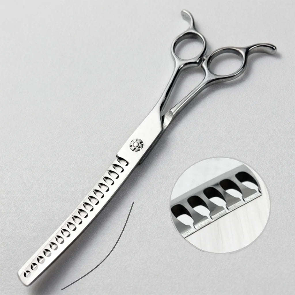 Silver professional pet grooming scissors with serrated blades and a circular view of the cutting edge.
