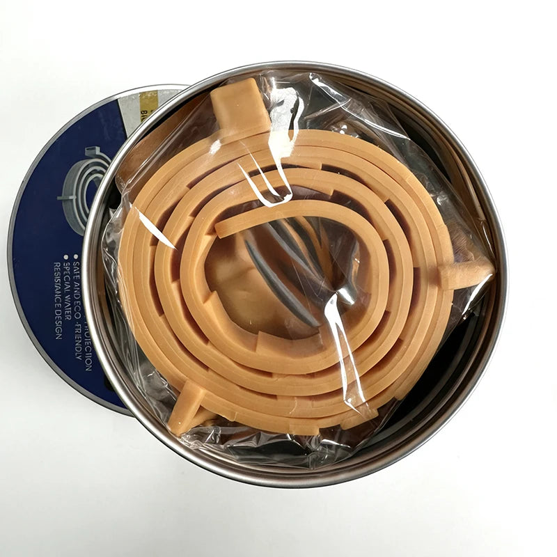 A coiled, light brown pheromone collar for cats and dogs is visible inside a metal tin.