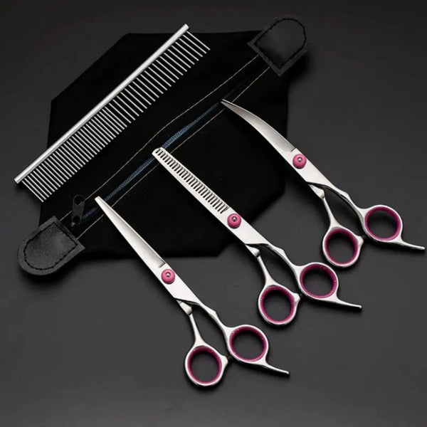 A set of grooming scissors and a comb are displayed on a black background.