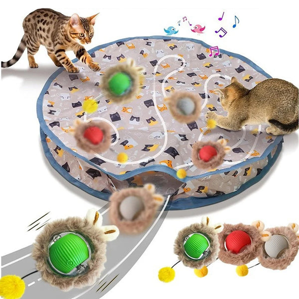 A smart interactive cat toy featuring various textured balls and a charging pouch, with a kitten playing on the surface.