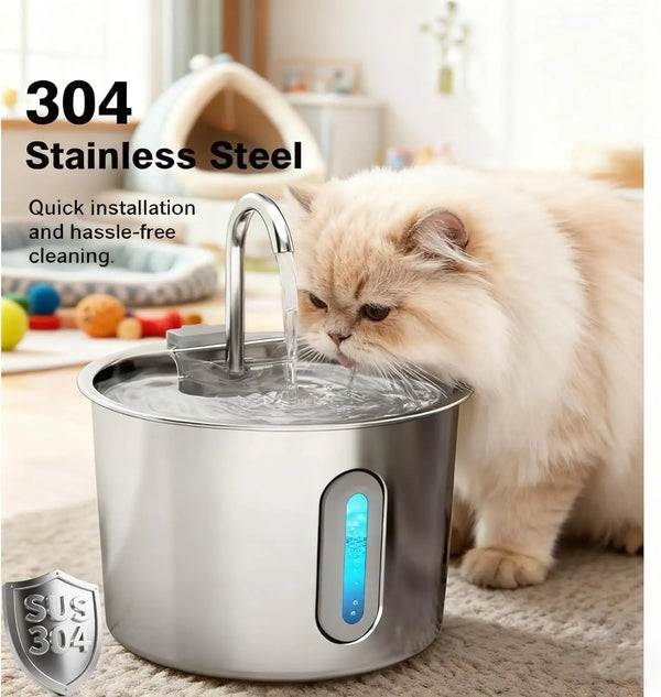 A stainless steel cat water fountain with running water is shown next to a fluffy cat.