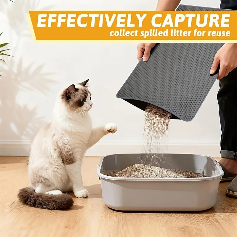 A cat is using a heavy duty waterproof litter mat to collect spilled litter into a container.