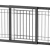A black adjustable wooden pet gate with vertical bars for indoor use.