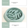 A light green anti-choking slow feeder bowl for pets, showing its rounded corners, PP material molding, and non-slip foot mat