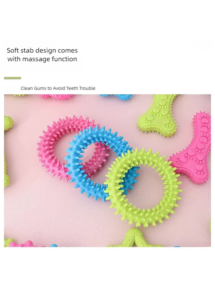 Colorful bone-shaped rubber chew toys for dogs, including pink, blue, and green textured rings.