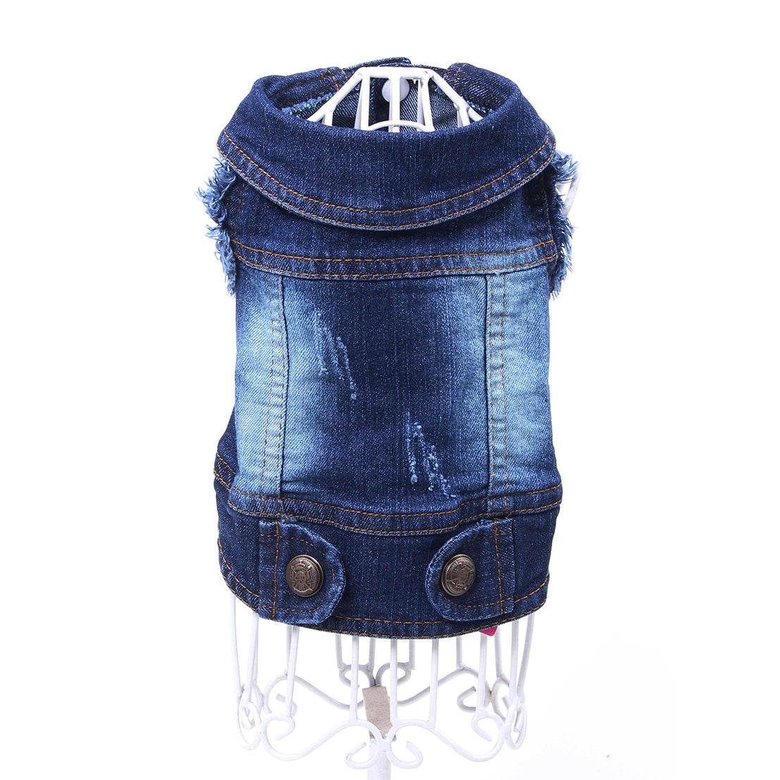 A dark blue denim vest with paw print detailing and fringed edges displayed on a hanger.