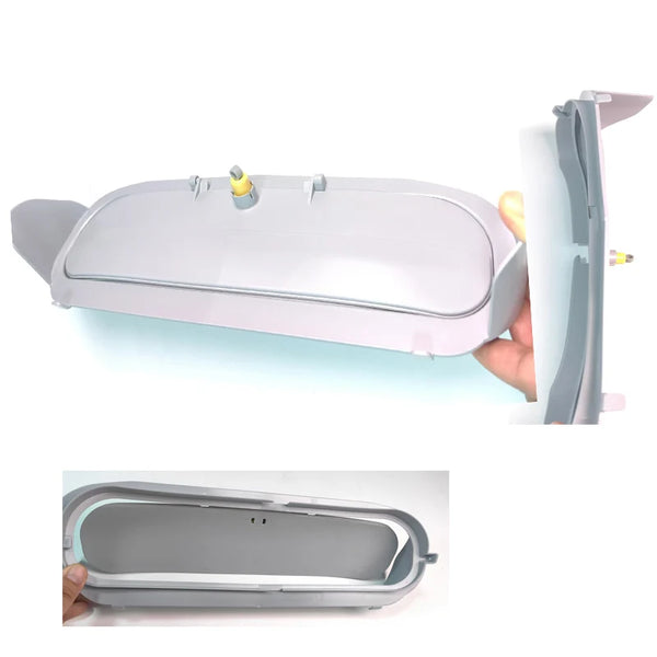 A gray plastic litter box accessory bin door is shown being removed from a larger unit.