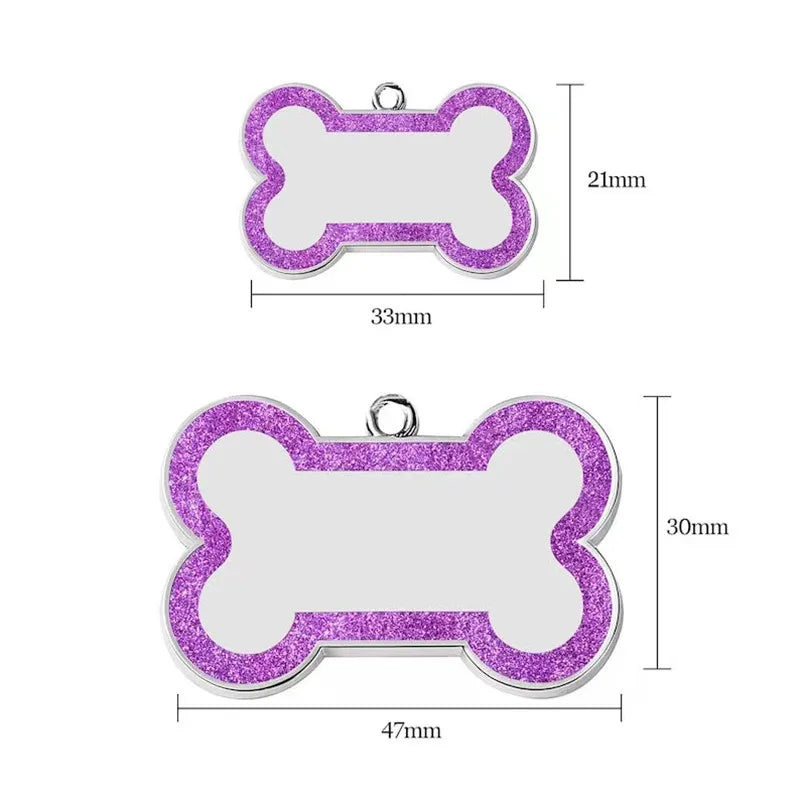 A purple glitter pet ID tag shaped like a bone, measuring 33mm long.