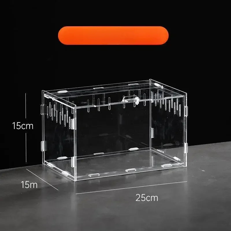 A clear acrylic reptile terrarium box with an orange light fixture and measurement lines.