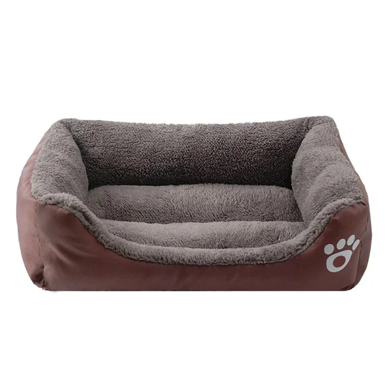 A brown dog bed with a plush, gray cushion and a paw print design.